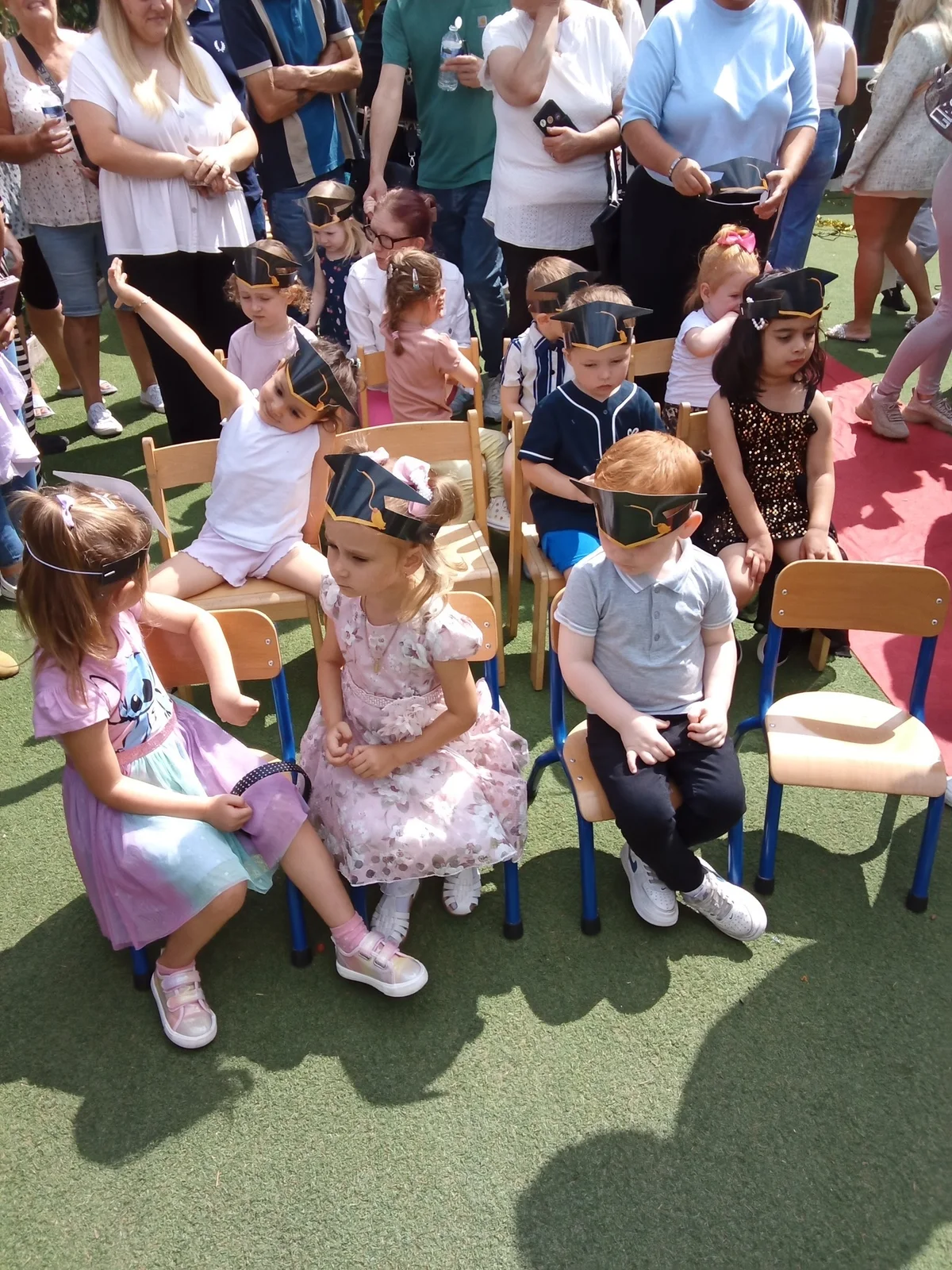 Children seated outside at Roobyloos Nursery