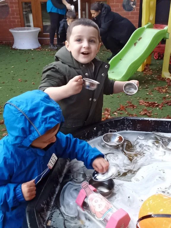 Child taking part in outdoor play at Roobyloos Nursery
