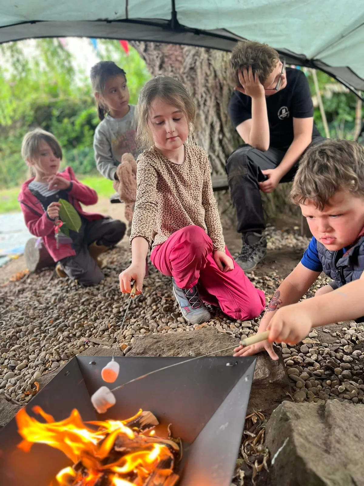 Children taking part in outdoor learning at Springfield Farm Day Nursery